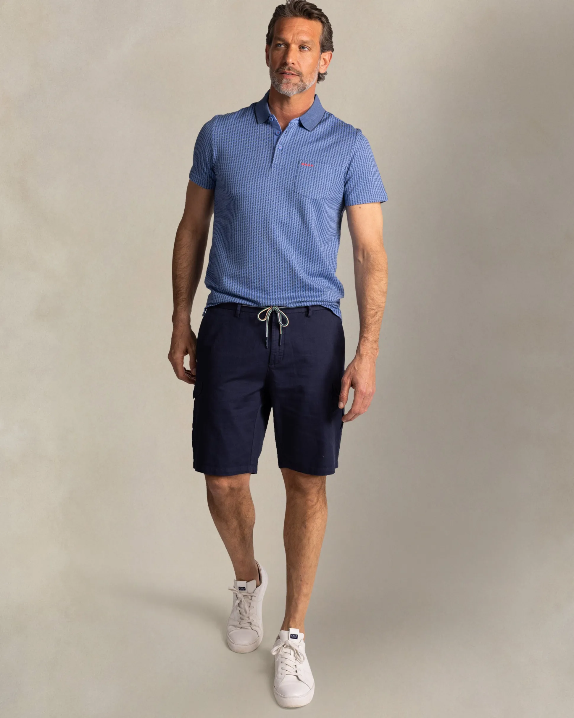 Blue polo with small white stripe