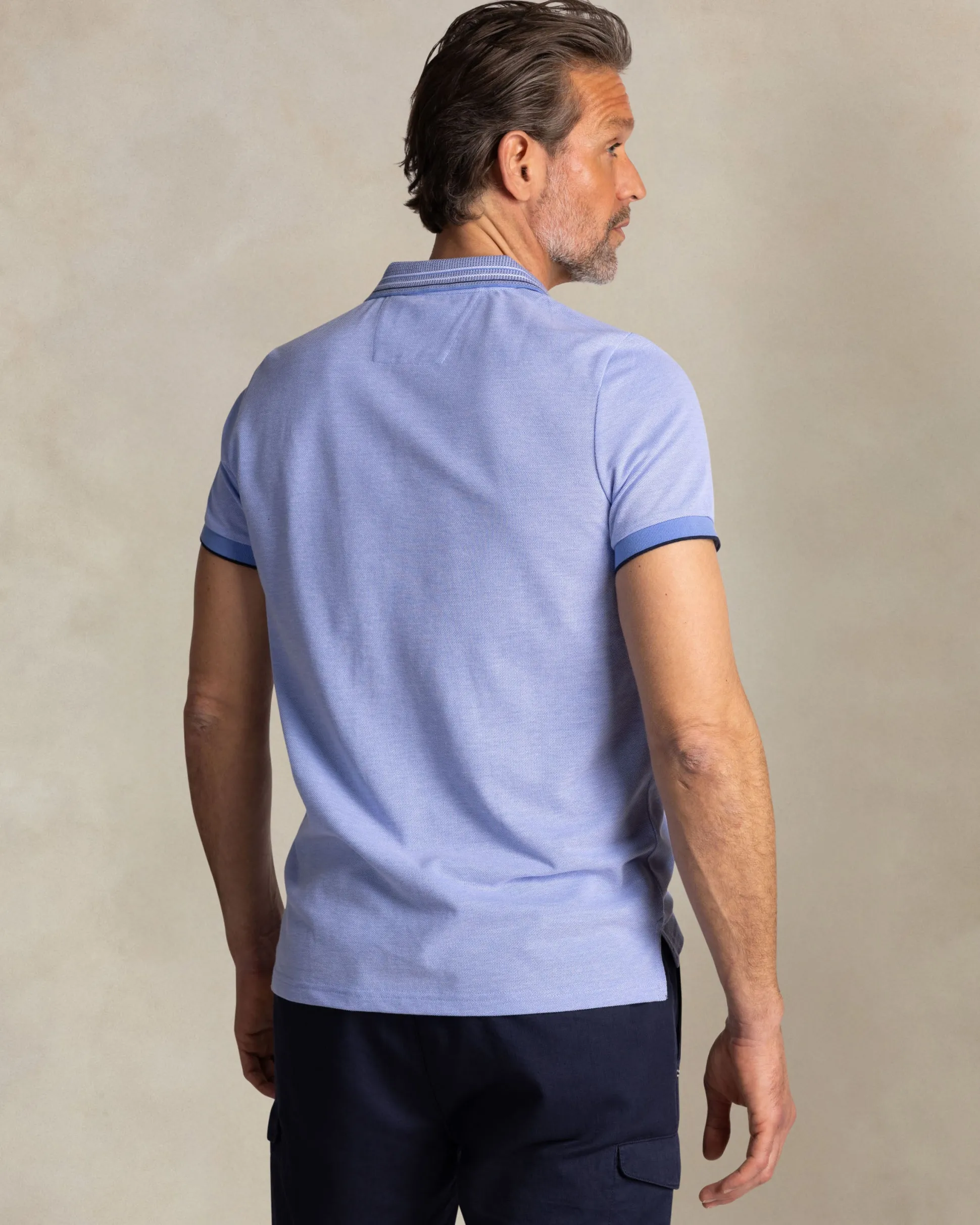 Bright blue polo with striped collar