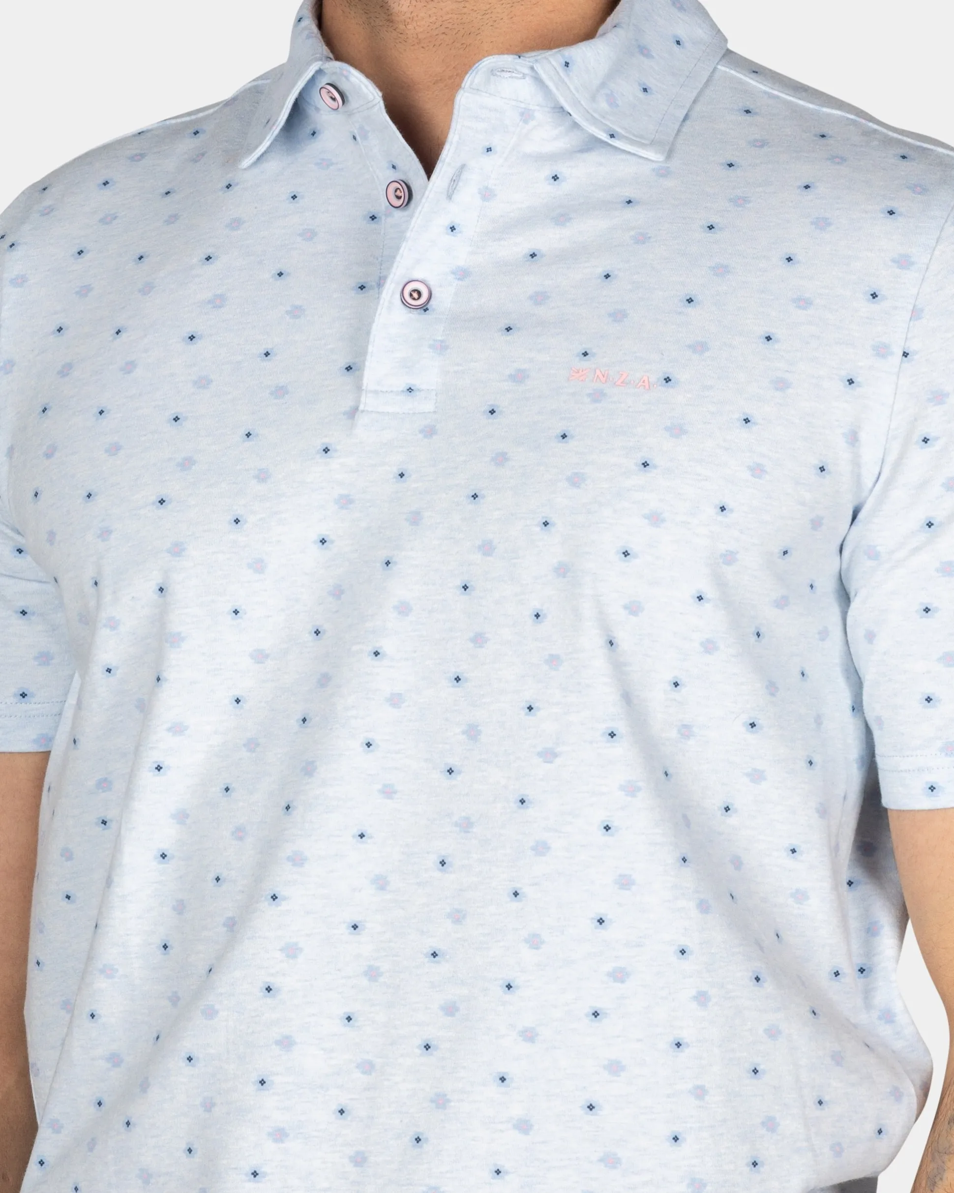 Cotton Pastel Blue Polo with a print of small polka dots