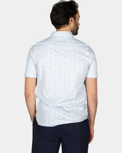 Cotton Pastel Blue Polo with a print of small polka dots