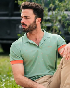 Green polo with orange accents