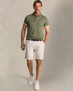 Green polo with small orange dots