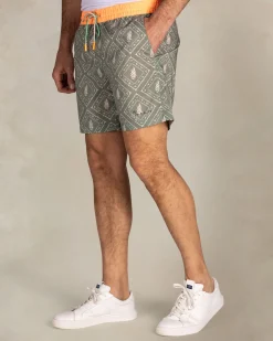 Green printed swim shorts with orange trim