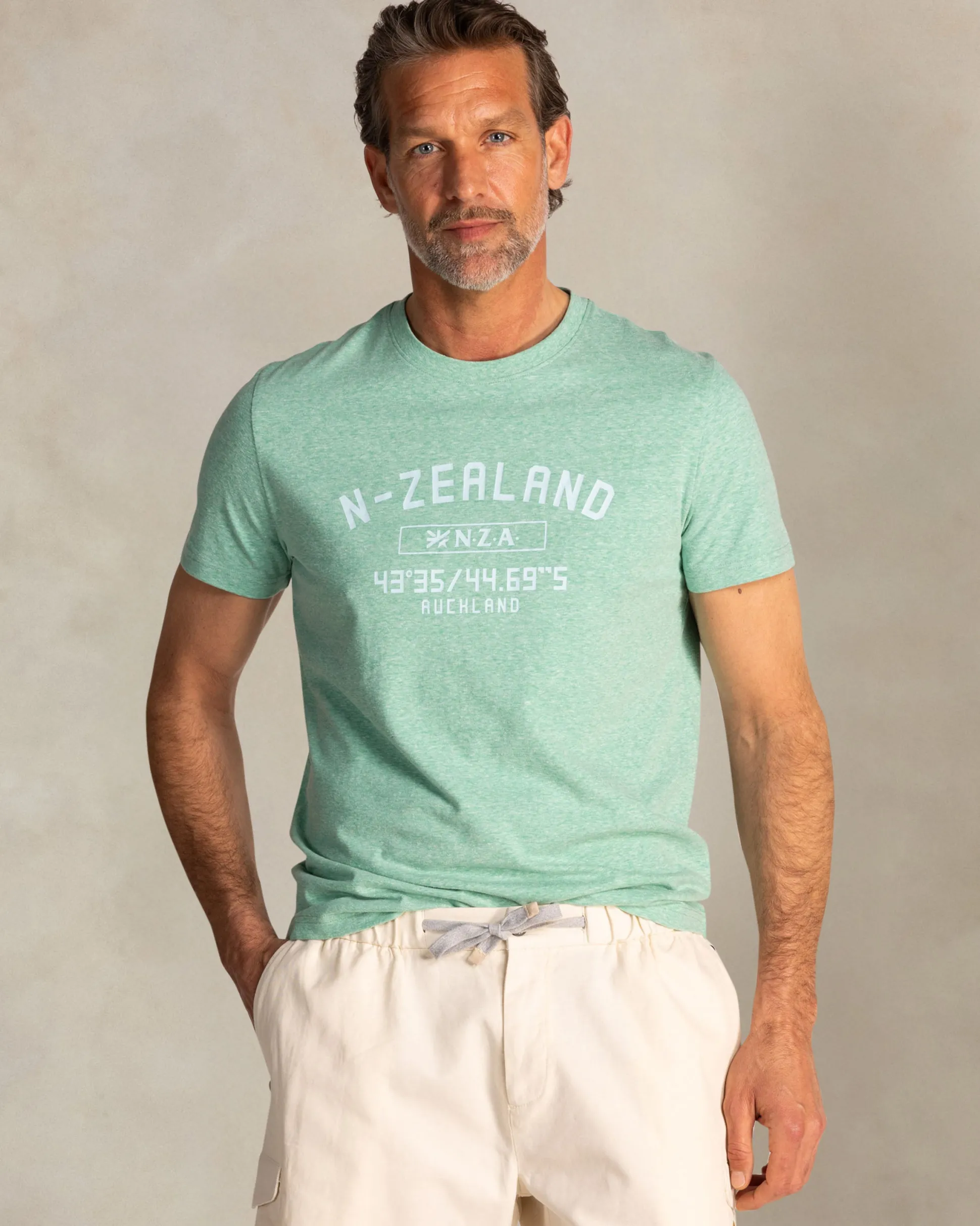 Green T-shirt with NZA logo on the chest