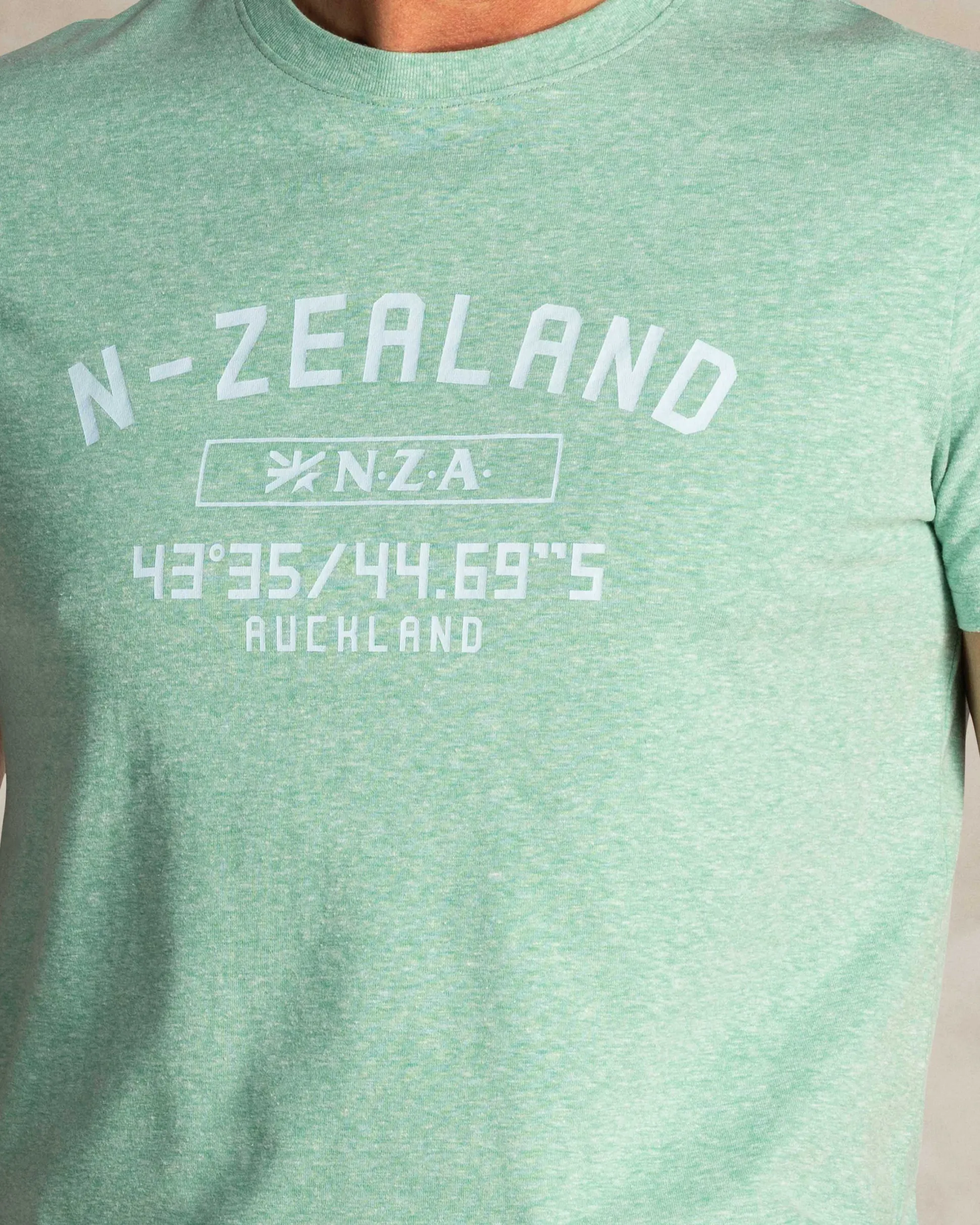 Green T-shirt with NZA logo on the chest