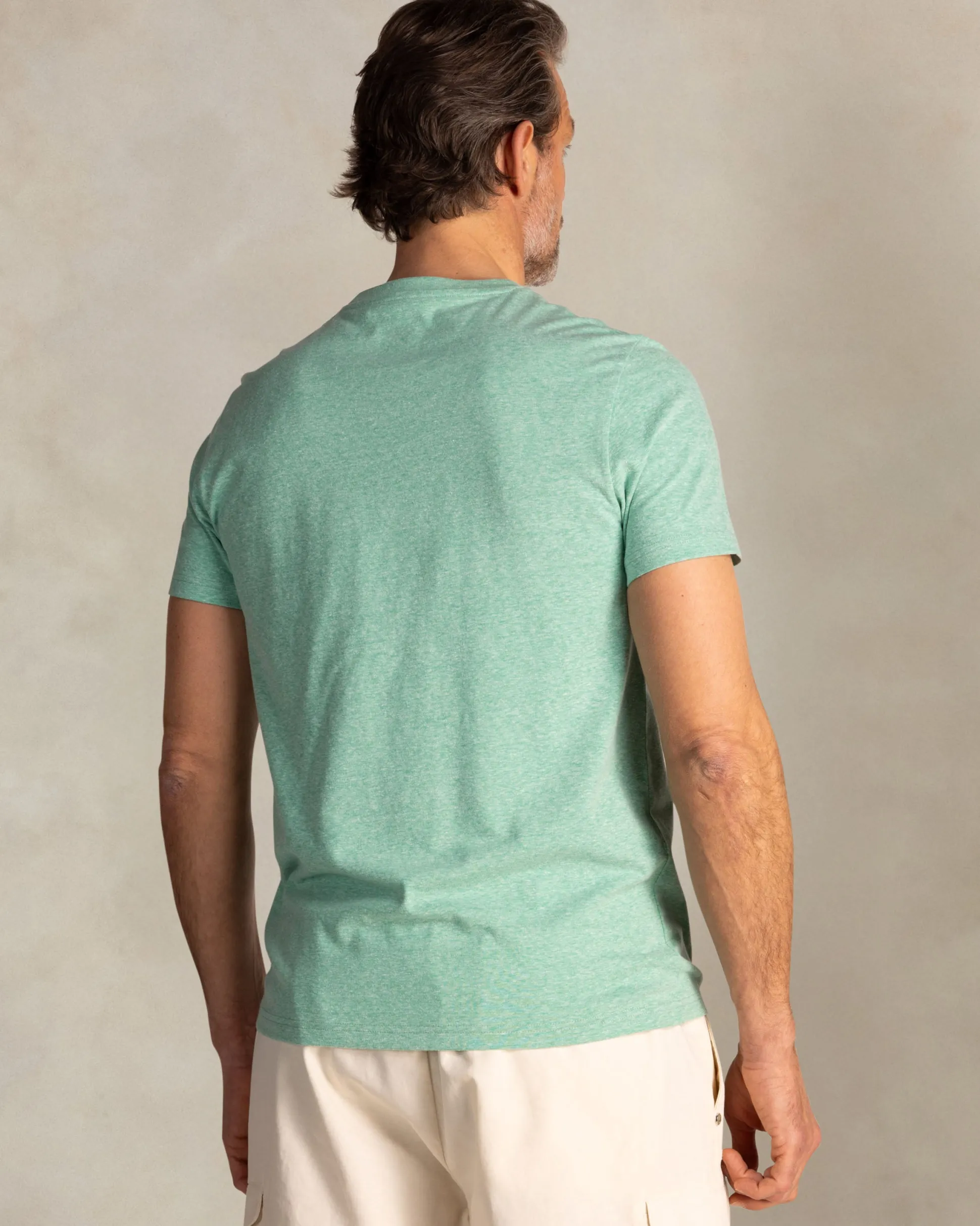 Green T-shirt with NZA logo on the chest