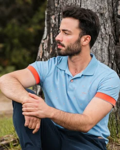 Light blue polo with orange accents