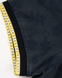 Navy polo shirt with leaf print