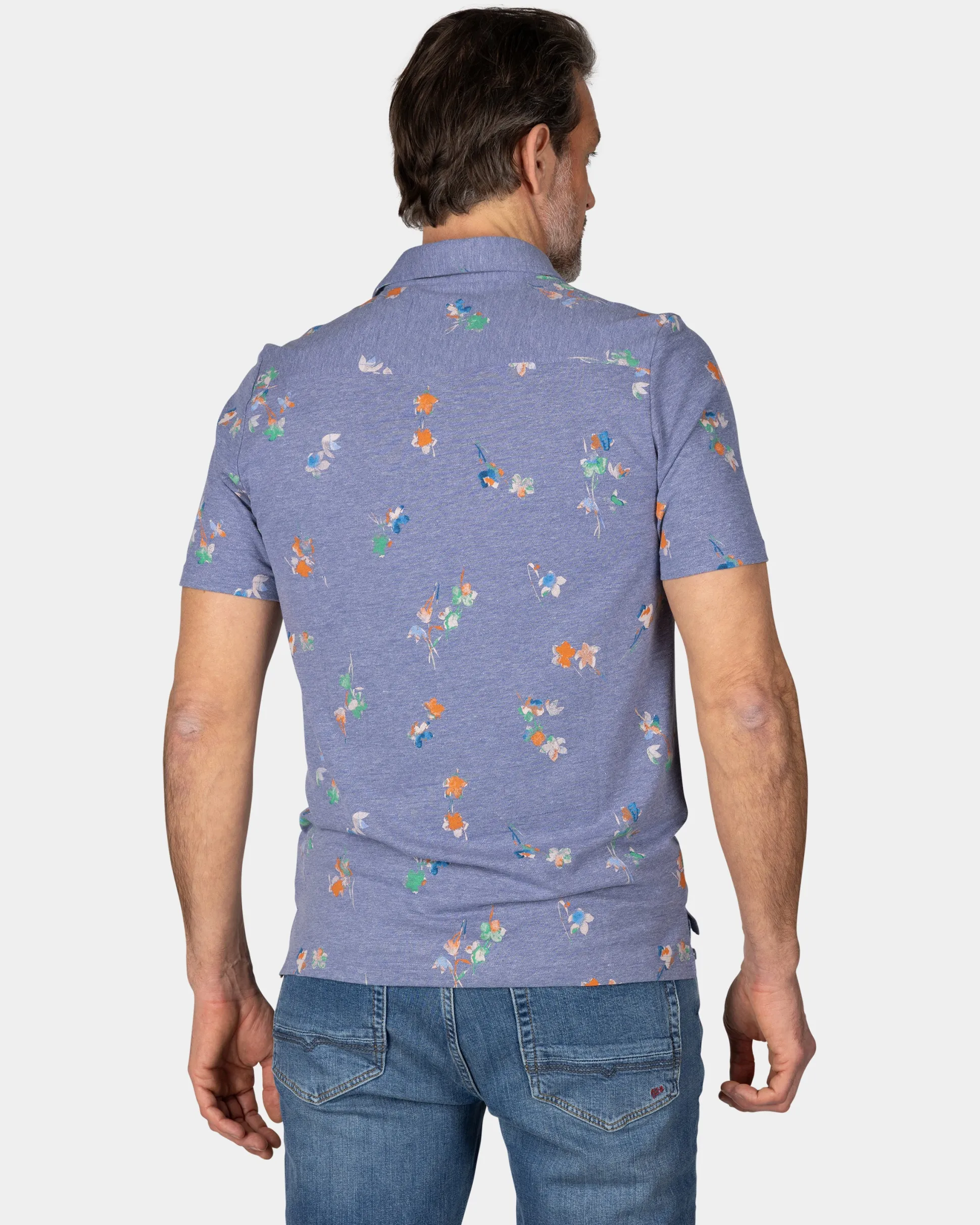 Navy polo shirt with leaf print