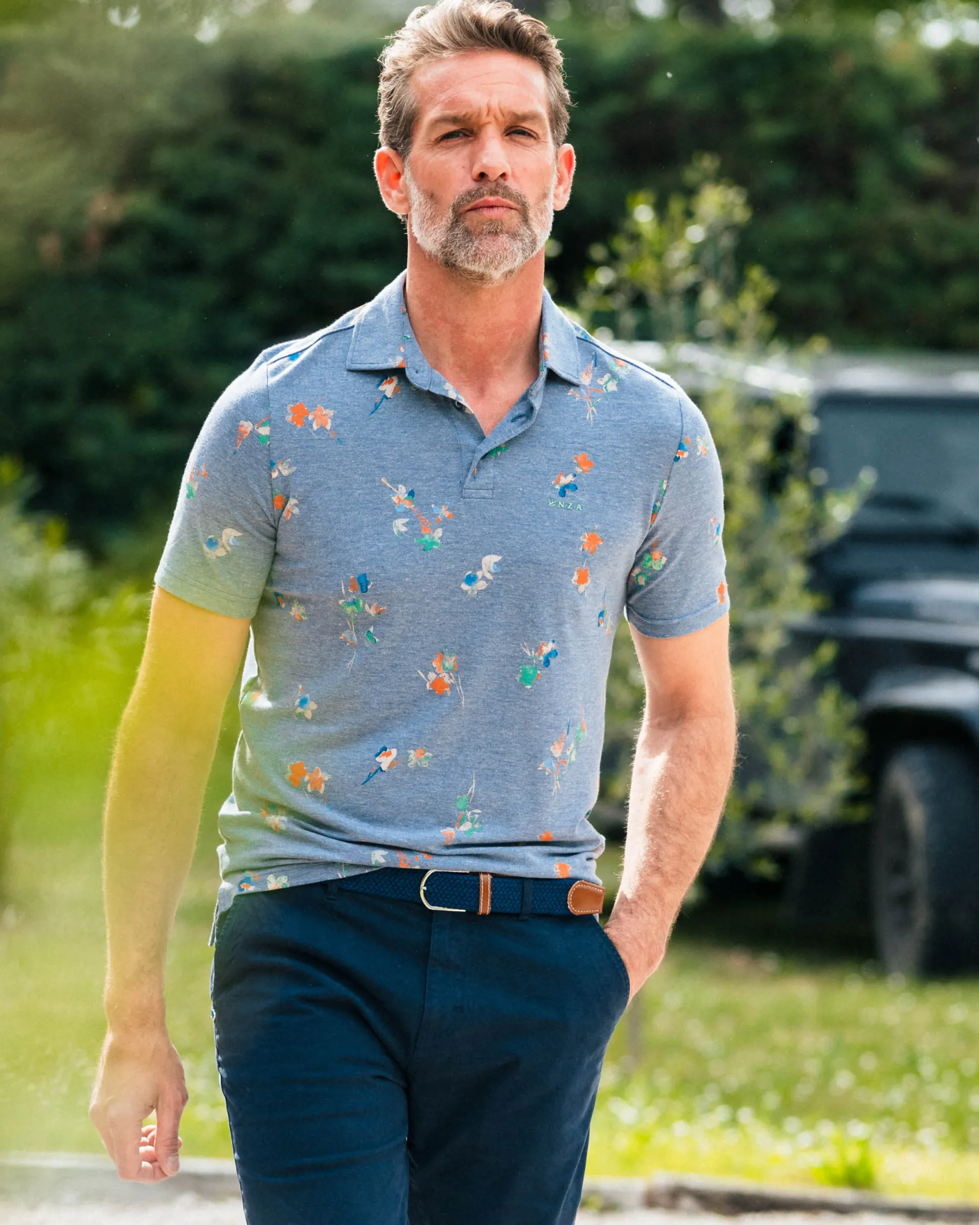 Navy polo shirt with leaf print