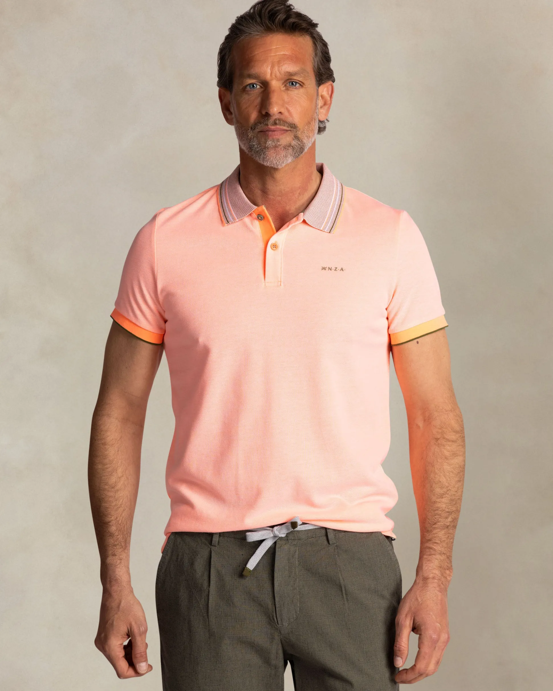 Orange polo with striped collar