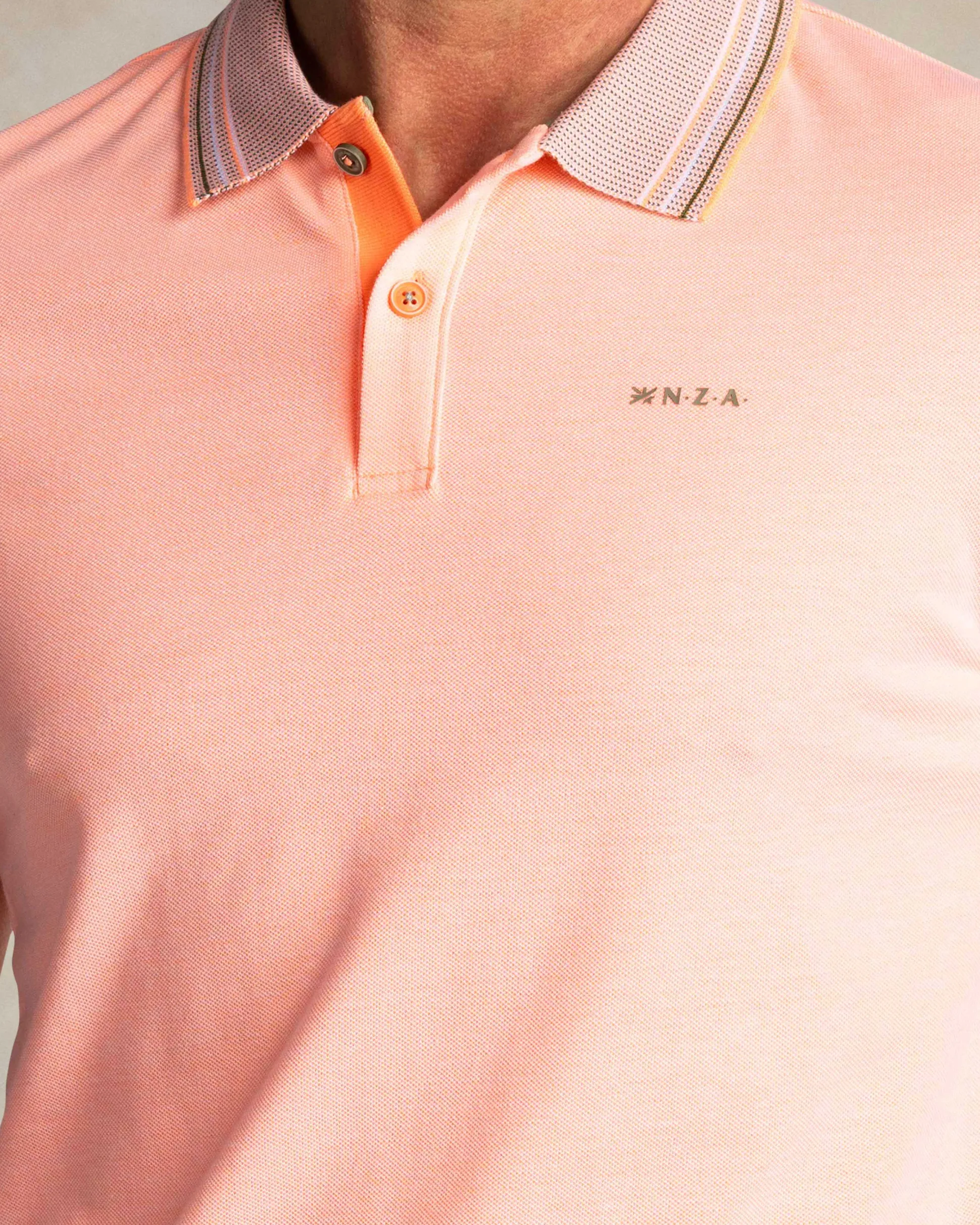 Orange polo with striped collar