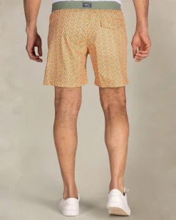 Orange printed swim shorts with green trim