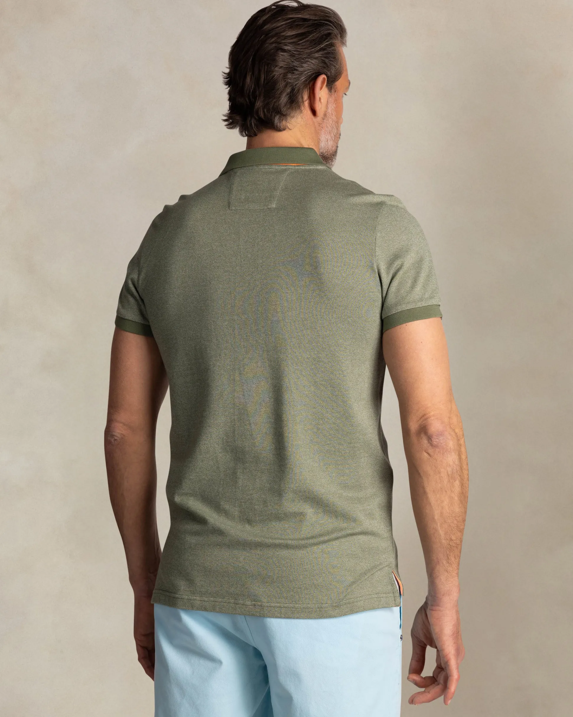 Solid green polo with orange details
