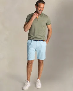 Solid green polo with orange details