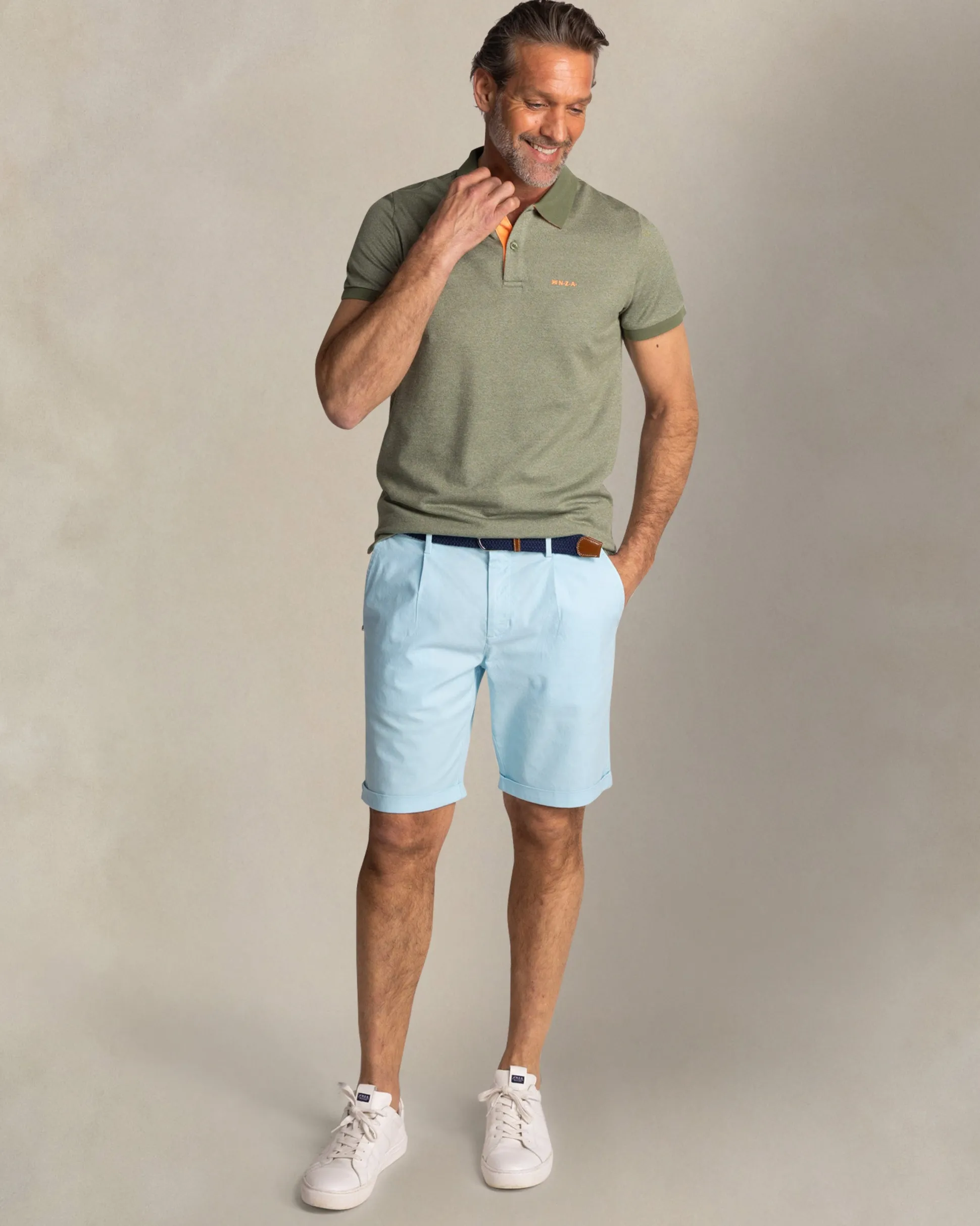 Solid green polo with orange details