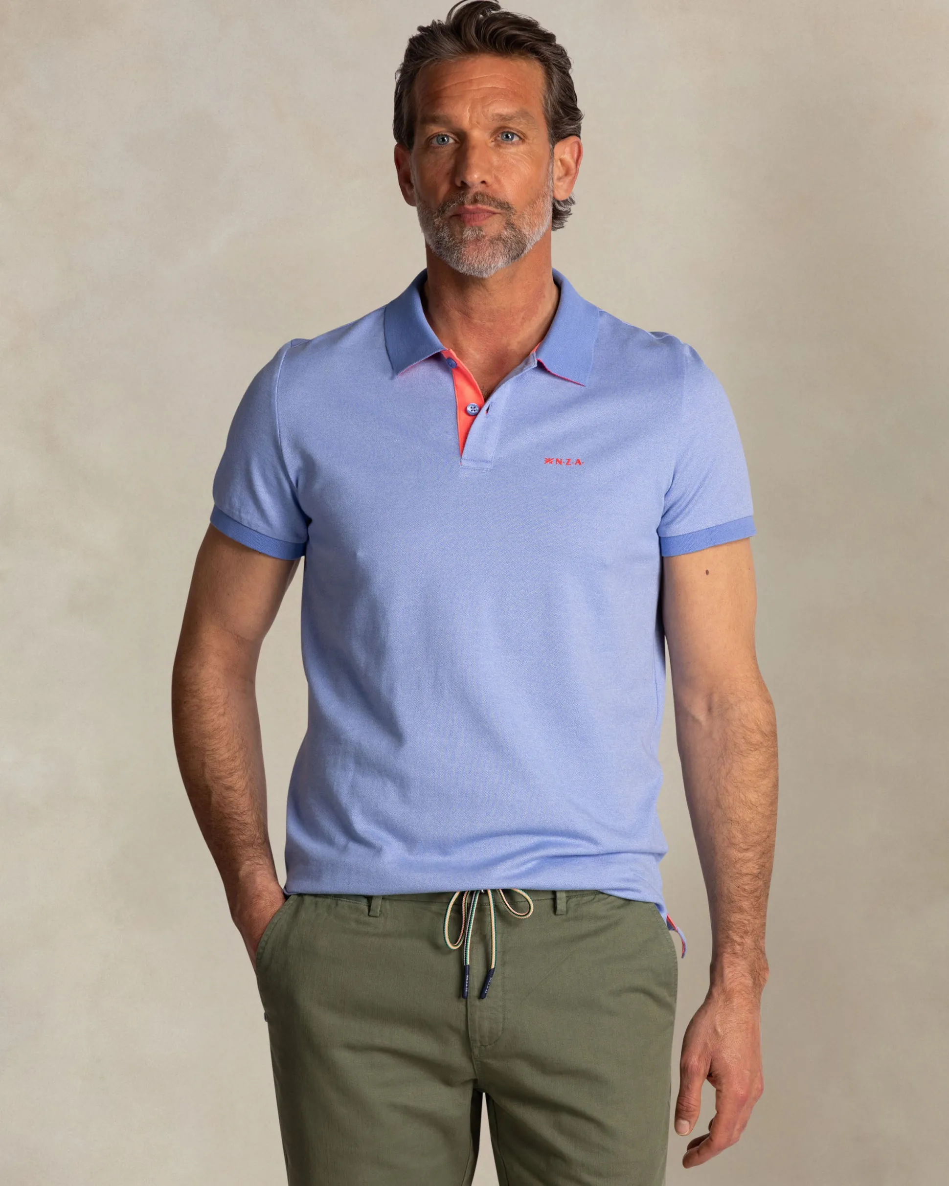 Solid light blue polo with orange details