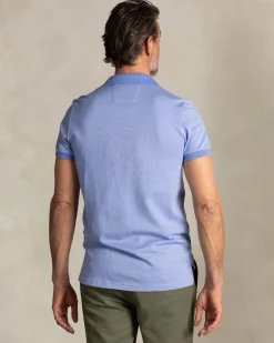 Solid light blue polo with orange details