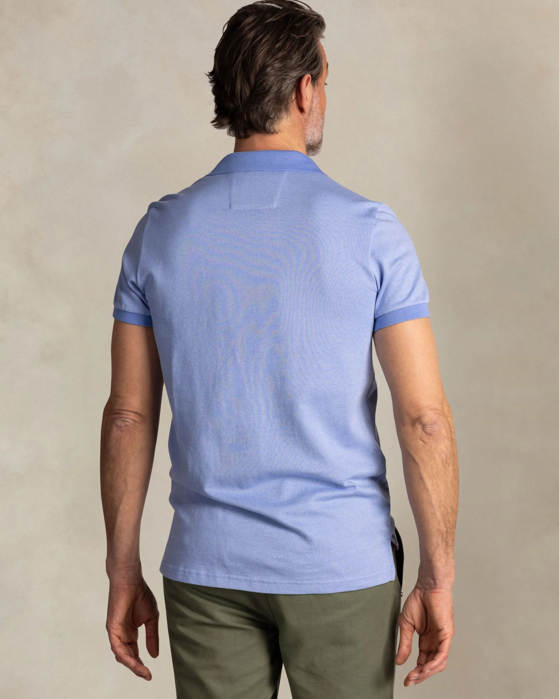 Solid light blue polo with orange details